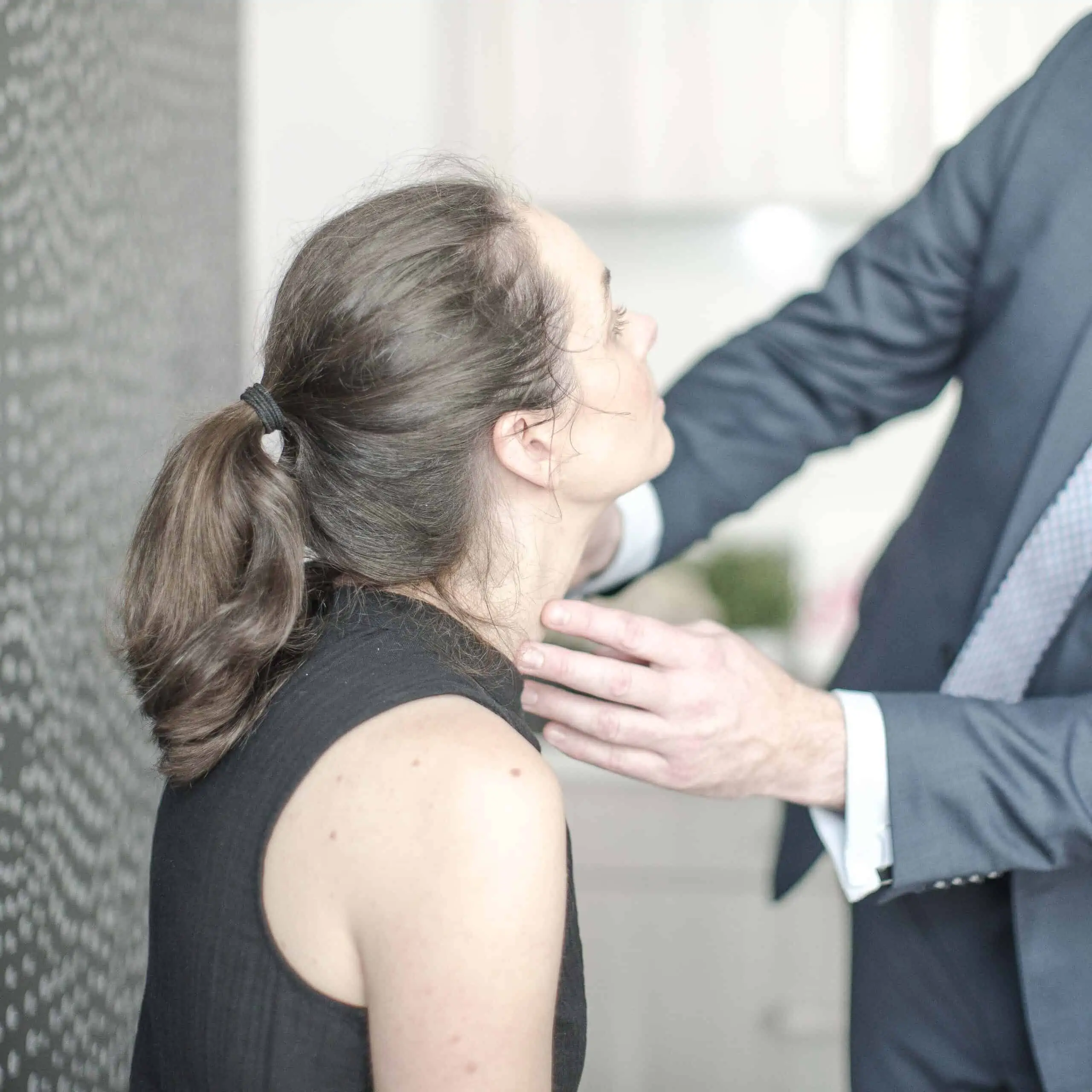 Dr Ben Lancashire examining a patient post-surgery