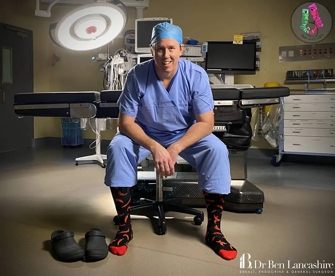 Dr Ben Lancashire in crazy socks and scrubs