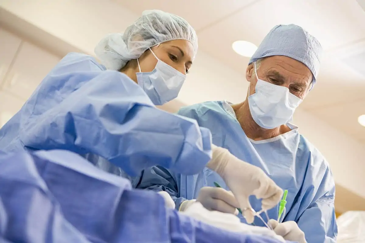 Surgeons performing thyroid surgery