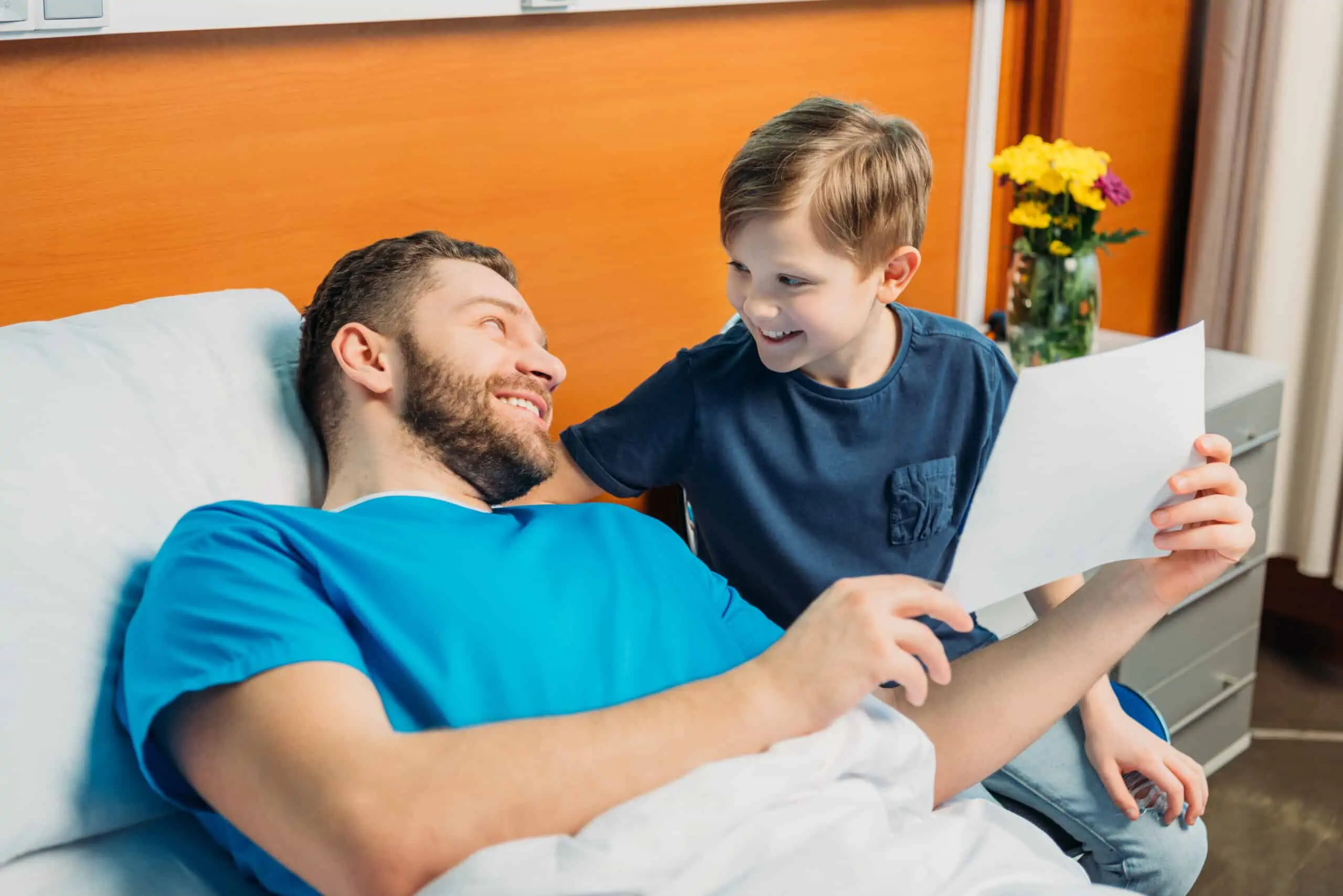 A patient and a child looking happy post operation